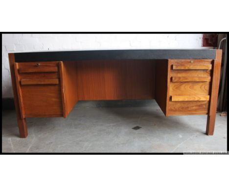 A retro Danish style Industrial 1960's / 1970's large twin pedestal desk, having a central recess flanked by floating drawer 