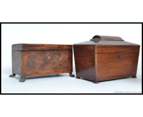Two antique tea caddies - the first mounted on ball and claw brass feet, both with partial interiors.  H13 x W22 X D12cm 