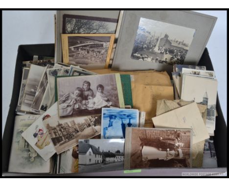 A collection  ( box ) of vintage postcards to include landscape, seascape etc. Also photographs etc