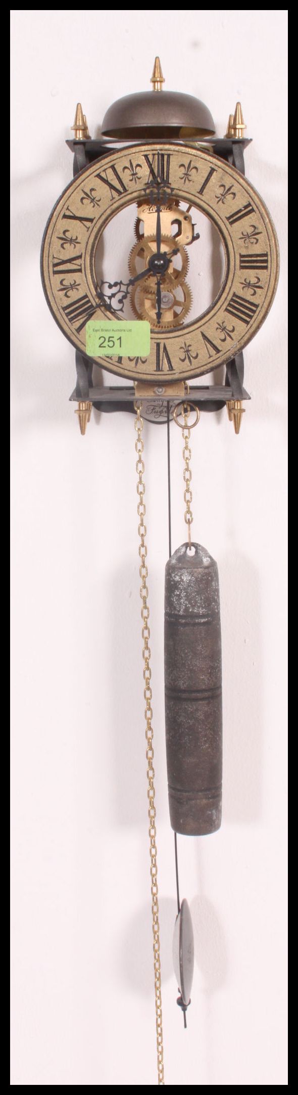 A Tempus Fugit wall skeleton clock marked for ' Hermle ' with pendulum