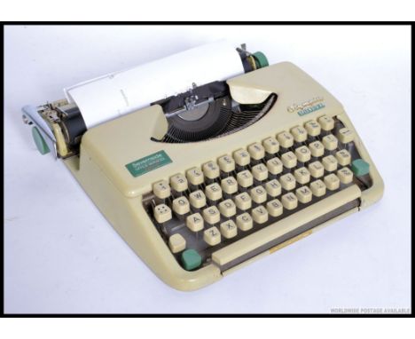 A retro cased 1960's / 1970's Olympia Splendid 35 typewriter, having had a recent service in really clean order, runs nice an