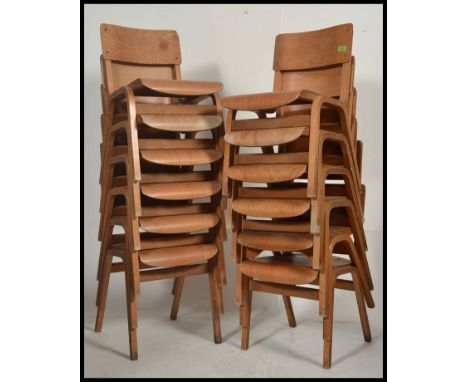 A stack of 12 vintage ply wood Industrial wooden school chairs. Angular bentwood legs with panel seats and back rests.  Measu