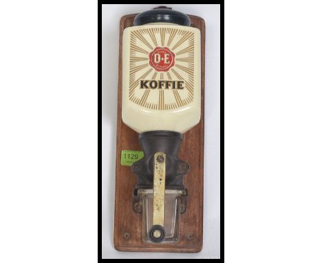 A vintage wall mounted Porcelain 2nd part of the 20th century advertising Coffee grinder from the Douwe Egberts Dutch coffee 