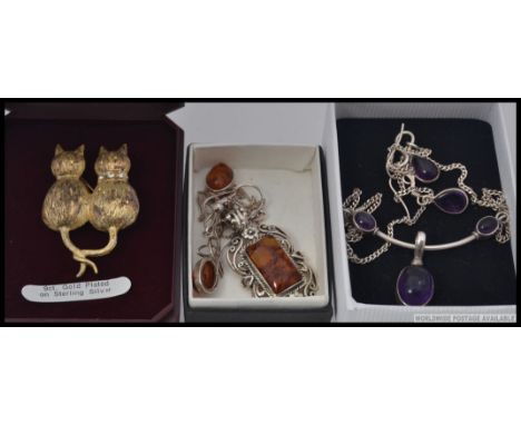 A collection of 3 silver cotemporary ladies necklaces to include Art Nouveau pendant and chain inset with amethyst, amber set