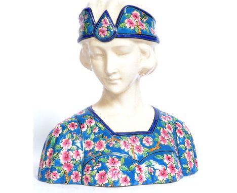 A 20th century Longwy style ceramic bust of a 1930's flapper girl. Hand painted.  Approx 24cm x 25.5cm