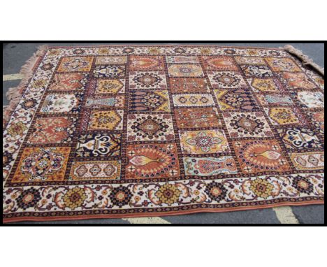A 20th century hanging wall tapestry together with a Chinese floor rug with tassled ends. Measure: 290 x 200 cm.