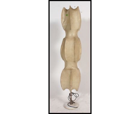 An unusual late 20th century retro vintage floor standing lamp of shaped form, with hide / skin covering having chrome base