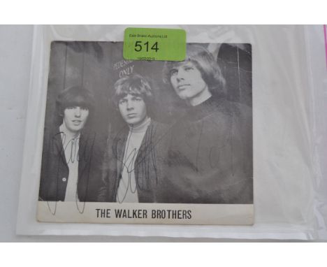 THE WALKER BROTHERS; An original vintage Walker Brothers fanclub publicity photograph, bearing the signatures in biro of the 