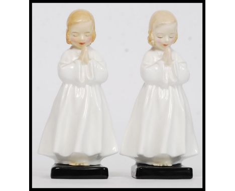 ROYAL DOULTON, A pair of Royal Doulton ceramic figures titled ' Bedtime ', stamped to the base RD No 842481, 1945. H14cm 