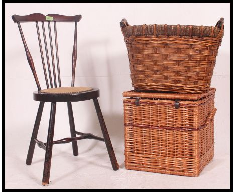 An early 20th century spinning chair along with a vintage whicker hamper and a whisker log basket. Measures: 77 x 33 x 33 cm.
