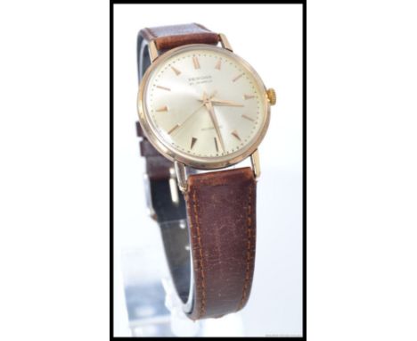 A vintage 1960's gentlemans Peronia 21 Jewel wristwatch having baton numeral dial with central notation. Set to a leather str