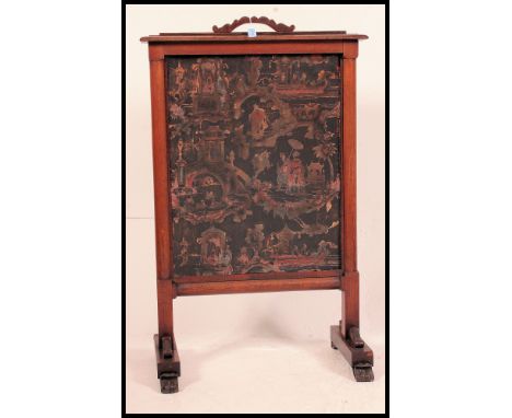 A 19th century Victorian mahogany firescreen. Raised on shaped legs with a central tapestry screen. Atop a carved and shaped 