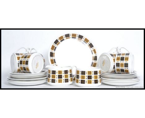 A retro fine bone china  tea service by Elixabethan in the ' Checkmate ' service consisting of six trios, creamer and sugar b