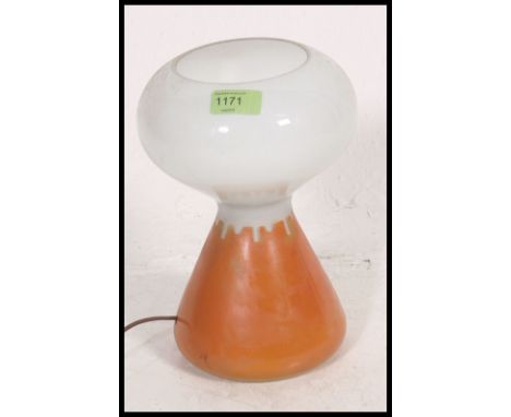 A 1960's glass two tone retro mushroom lamp in orange and white in the manner of John Ditchfield. H27cm 