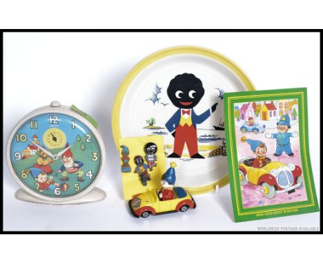 A collection of Enid Blyton's Noddy items to include a Smiths Noddy alarm clock, Noddy car, Noddy's Car 7" vinyl record, a Ro