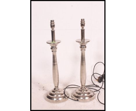 A pair of heavy quality chrome table / desk lamp bases. Each with stepped circular bases and fluted stems. 