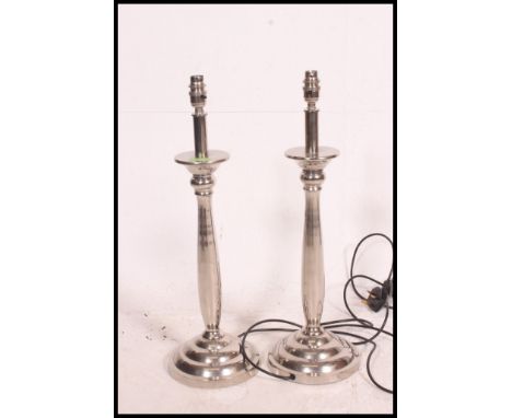 A pair of heavy quality chrome table / desk lamp bases. Each with stepped circular bases and fluted stems. 