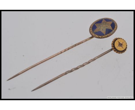 2 9ct gold Victorian hat - stick pins, one being enamel set with the other having central star motif. Total weight 3.6g