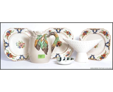 A Clarice Cliff ceramic jug with leaf and cloud design together with Hornsea  vase, Ironstone plates and a John Clapton desig