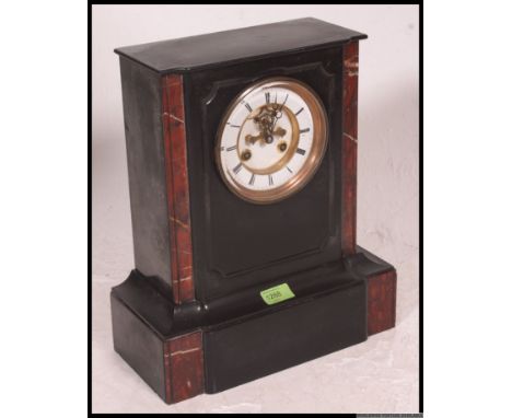 A Victorian black slate and rouge marble mantle clock of architectural form, the Roman enamelled dial with outer minute track