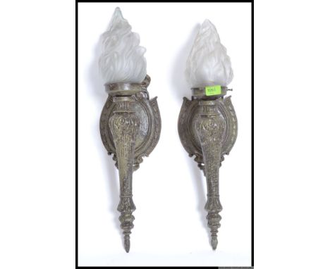 An early to mid 20th Century  wall light fitting in the form of a torch with flame shaped frosted glass shades. H60 cm 