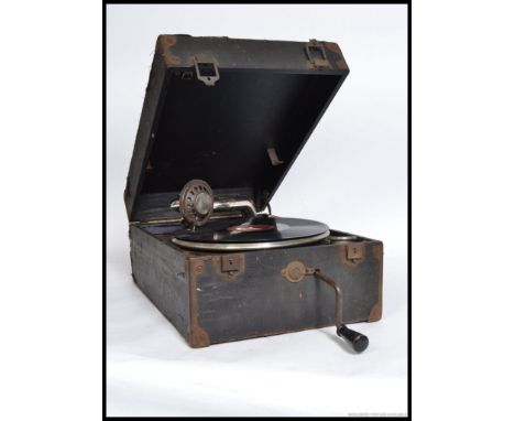 A vintage portable Decca gramophone, with handle and some accessories within the original case. AF.