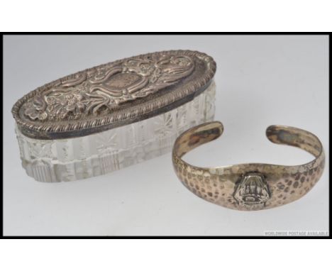 A 20th century Sterling silver American hand beaten ladies bracelet with coat of arms for Chicago 1833 - 1933. Total weight 2