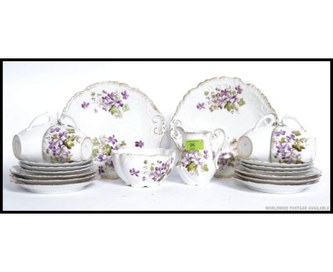 An early 20th century Staffordshire part tea service comprising cups, saucers, plates etc