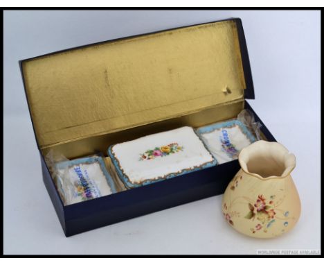 A fabulous boxed unused Royal Crown Staffordshire dressing table set in box together with a Royal Worcester Ivory blush vase 