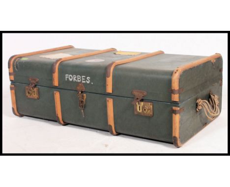 A vintage early 20th century canvas and and banded steamer trunk having notation to the case Forbes. Measures: 32 x 92 x 52