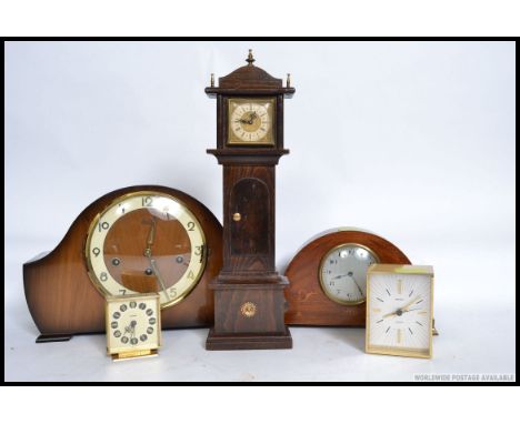 A 1940's mantel clock together with a miniature grandfather clock, Swiza alarm clock, carriage clock etc