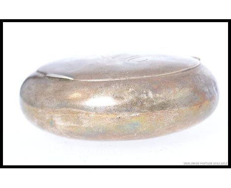 A silver hallmarked ladies powder pot or large snuff box. pill shaped form with central monogram bearing hallmarks for Willia