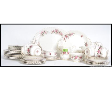 A Royal Albert Lavender Rose chintz pattern tea service comprising cups, saucers, plates, sugar bowl, creamer, platter etc