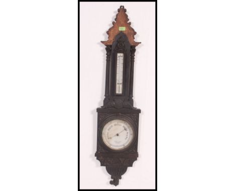 A Victorian Irish large oak aneroid wall barometer. The dial marked for Cahoon Bros, 55 Dougall Place, Belfast. H115 x W28cm 