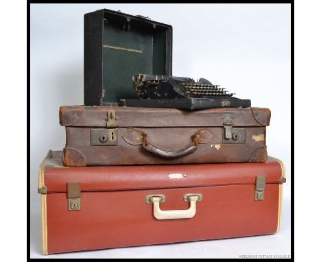 A vintage Corona typewriter complete in the original case together with a good leather vintage suitcase with original shippin