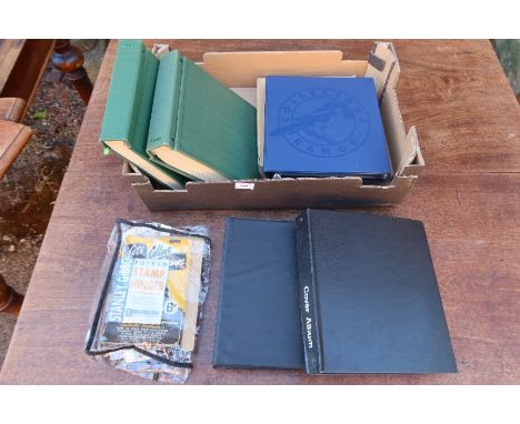 A box of assorted stamps to include First Day Covers and albums relating to stamps from around the world