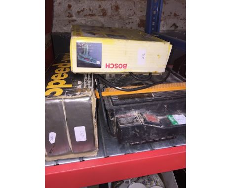 An electric tile cutter, a hot air gun and a hand held vac 