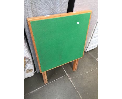 A green baize folding card table. 