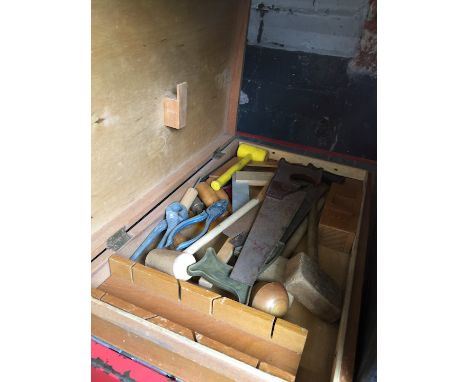 A childs carpenters wooden tool box with tools 