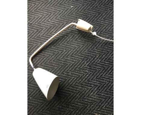A retro white wall mounting angle lamp. 