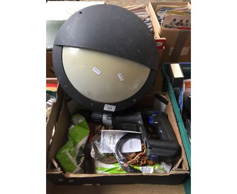 A box of tools including a lamp 