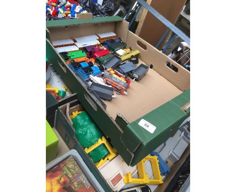 Three boxes of Thomas the Tank Engine model railway. 