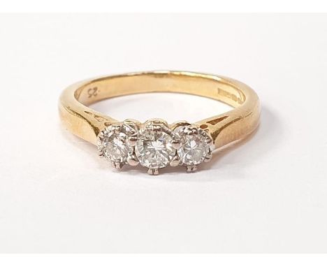 18ct gold three stone diamond ring size K. 