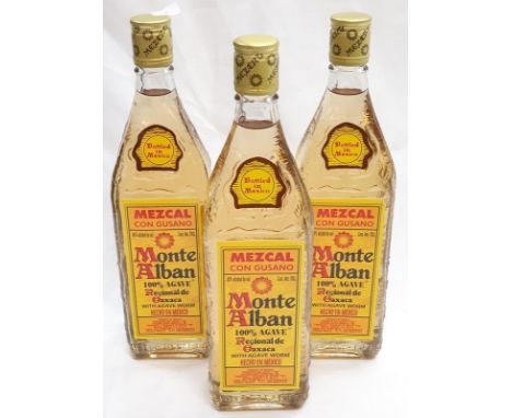 Three bottles of Monte Alban Tequila. 
