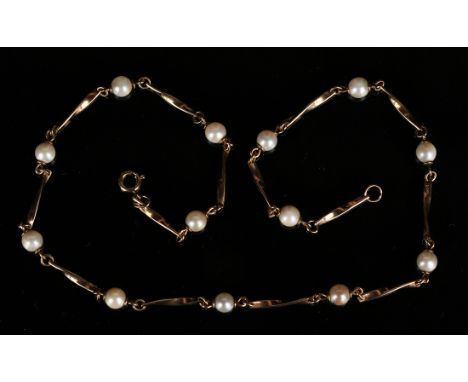 A 9ct gold and cultured pearl necklace in a twisted bar link design spaced with cultured pearls, on a boltring clasp, length 