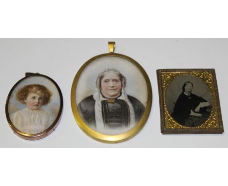 A.M.W. - Oval Miniature Portrait of a Child, watercolour possibly over a printed base, 6cm x 4.5cm, within a gilt metal frame