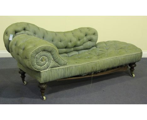 A Victorian chaise-longue, the buttoned scroll back and upholstered seat raised on turned walnut legs with beaded bands, term