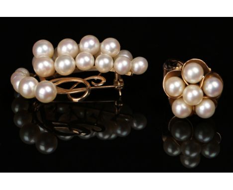 A gold and cultured pearl cluster ring, mounted with six cultured pearls, detailed '14k', ring size approx N, and a gold and 