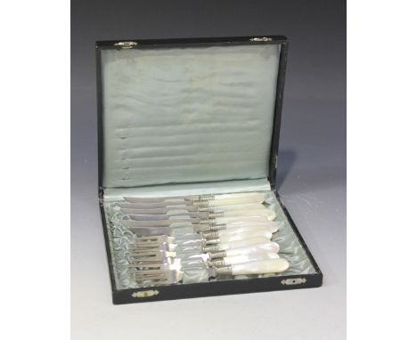 A set of six French plated fruit knives and forks with mother-of-pearl handles, cased.
