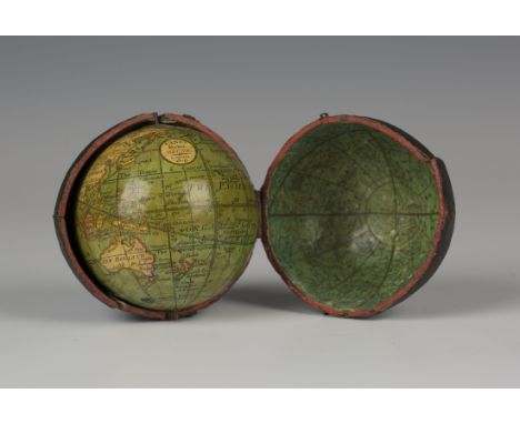 An early 19th century Lane's pocket globe, the 2¾ inch terrestrial globe with printed and hand coloured gores, labelled 'Lane